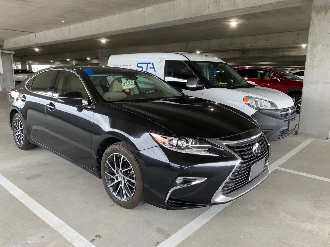 A couple of cars parked in a parking lot.